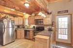 Arrow Lodge -Kitchen with stainless steel appliances.